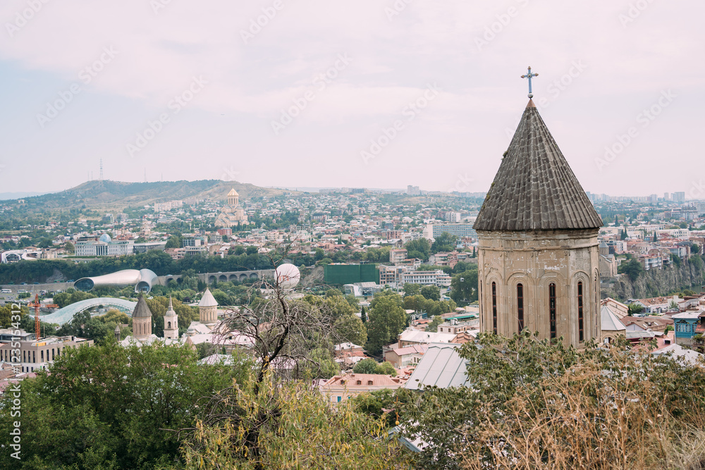 Panoramic view of an old city with historic architecture and modern buildings. Tbilisi, Georgia Panoramic view of an old city with historic architecture and modern buildings. Tbilisi, Georgia