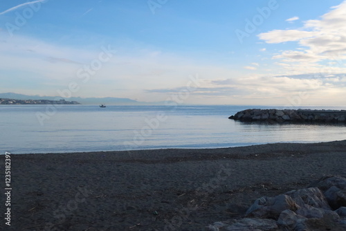 Morning scene on the beach of Fuengirola in Spain photo