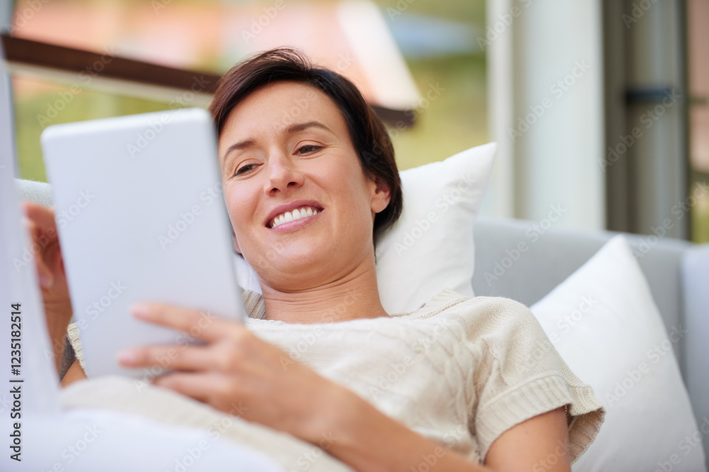 Sofa, relax and woman with tablet for ebook, online entertainment and web subscription at home. House, female person and happy with digital for interactive app, social media and game in living room Sofa, relax and woman with tablet for ebook, online entertainment and web subscription at home. House, female person and happy with digital for interactive app, social media and game in living room