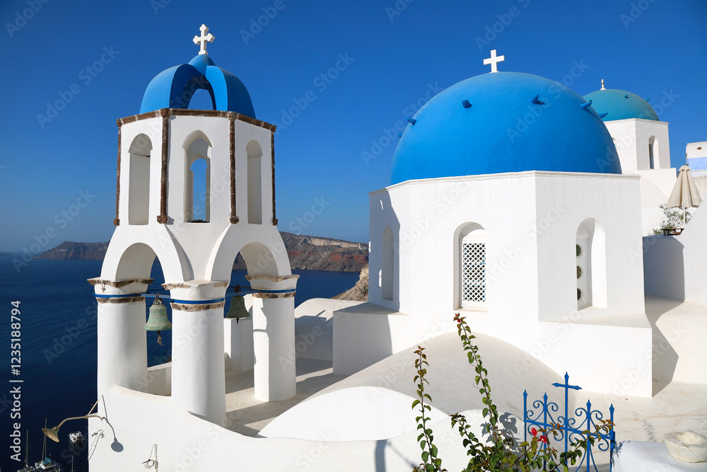 Oia Santorini's iconic blue-domed churches overlooking the island's volcanic caldera and the Mediterranean Sea
Oia Santorini's iconic blue-domed churches overlooking the island's volcanic caldera and the Mediterranean Sea