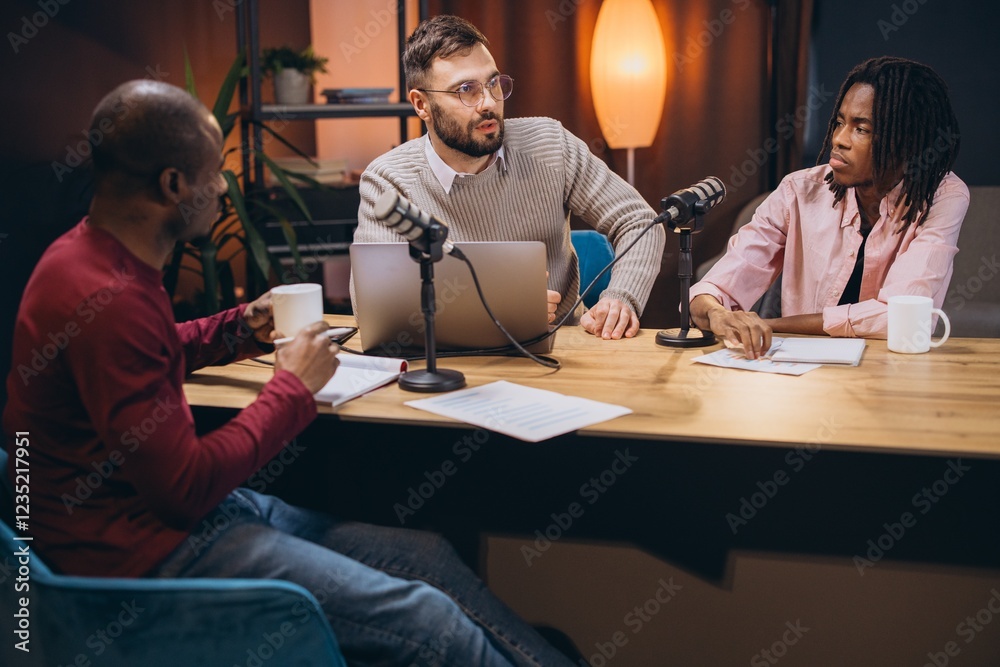 Three radio hosts recording a podcast in a professional studio, engaging in discussion and sharing insights with their audience Three radio hosts recording a podcast in a professional studio, engaging in discussion and sharing insights with their audience