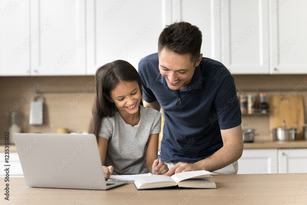 Let me explain. Loving millennial dad support small school age daughter help child with understanding new material from online lesson check homework. Friendly father and kid doing assignment together Let me explain. Loving millennial dad support small school age daughter help child with understanding new material from online lesson check homework. Friendly father and kid doing assignment together