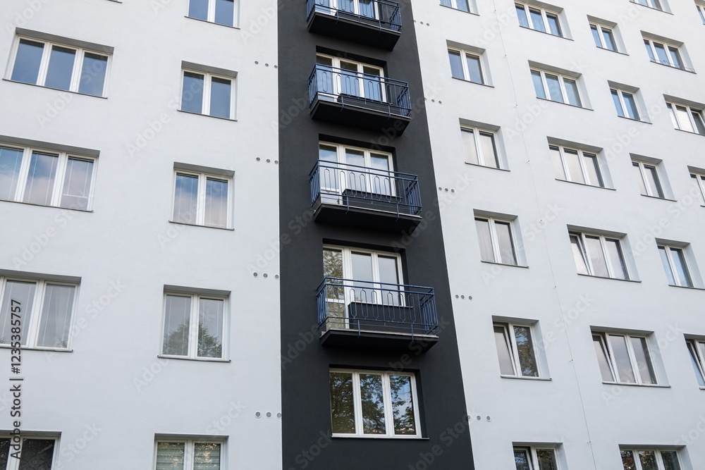 Reconstructed facade on white block of flats