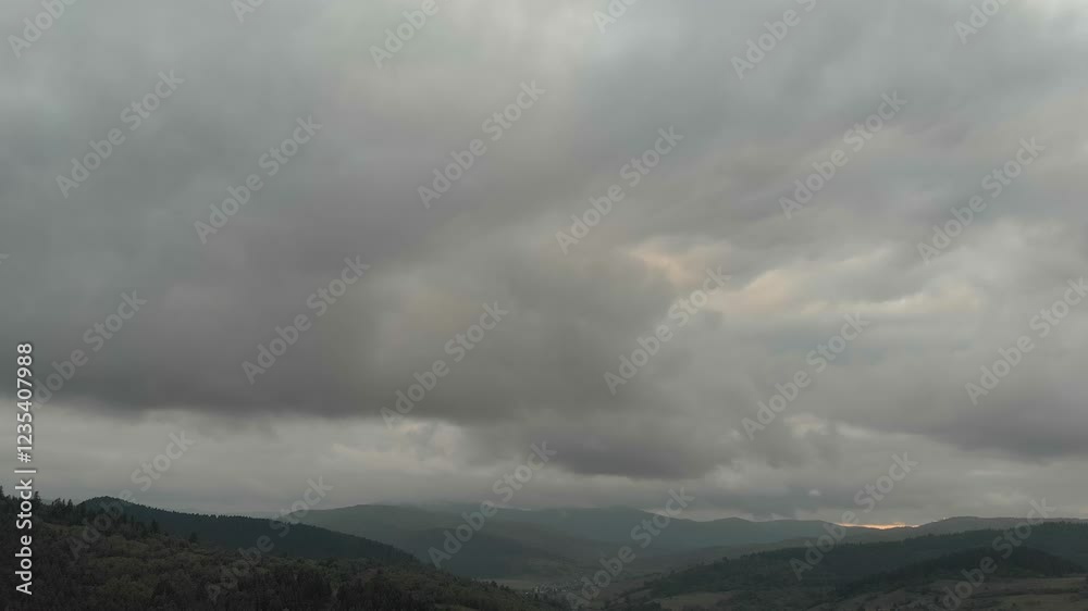 Majestic Mountains Shrouded In Dense Forests Under Ominous Clouds, As Rain Showers Descend Upon The Verdant Landscape, Capturing The Raw Beauty Of Nature's Elements In Harmony. Majestic Mountains Shrouded In Dense Forests Under Ominous Clouds, As Rain Showers Descend Upon The Verdant Landscape, Capturing The Raw Beauty Of Nature's Elements In Harmony.