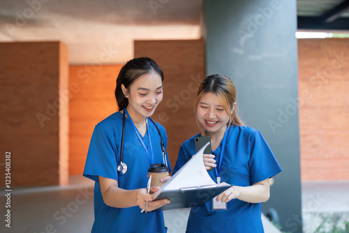 Doctors reviewing notes and enjoying coffee during a break
