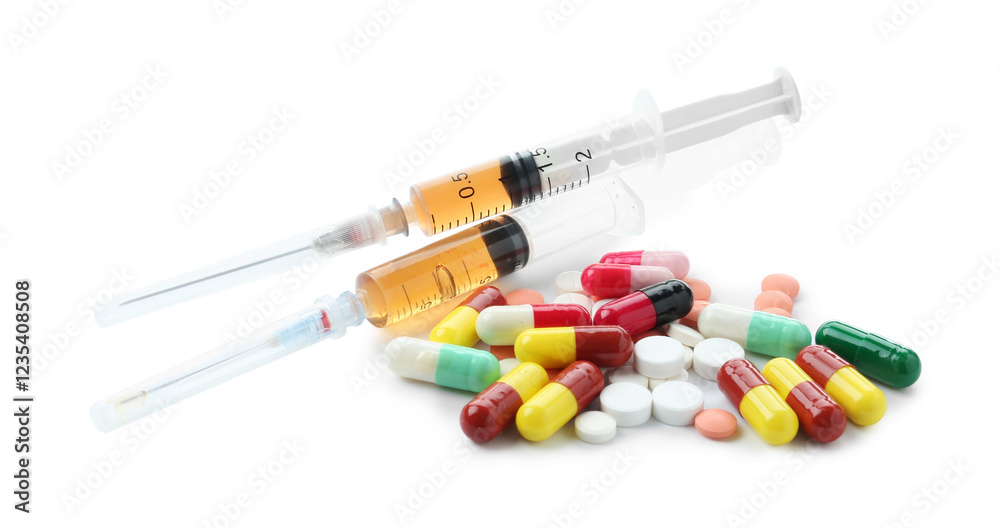 Drug addiction. Different pills and syringes isolated on white Drug addiction. Different pills and syringes isolated on white