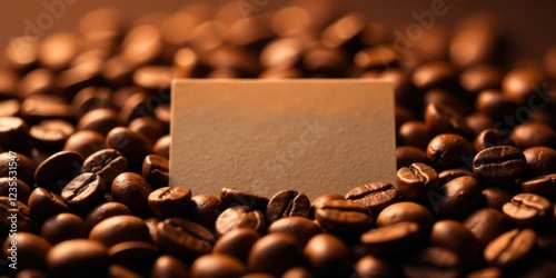 A Blank Notecard Nestled Amongst Roasted Coffee Beans, Ready for Your Message photo