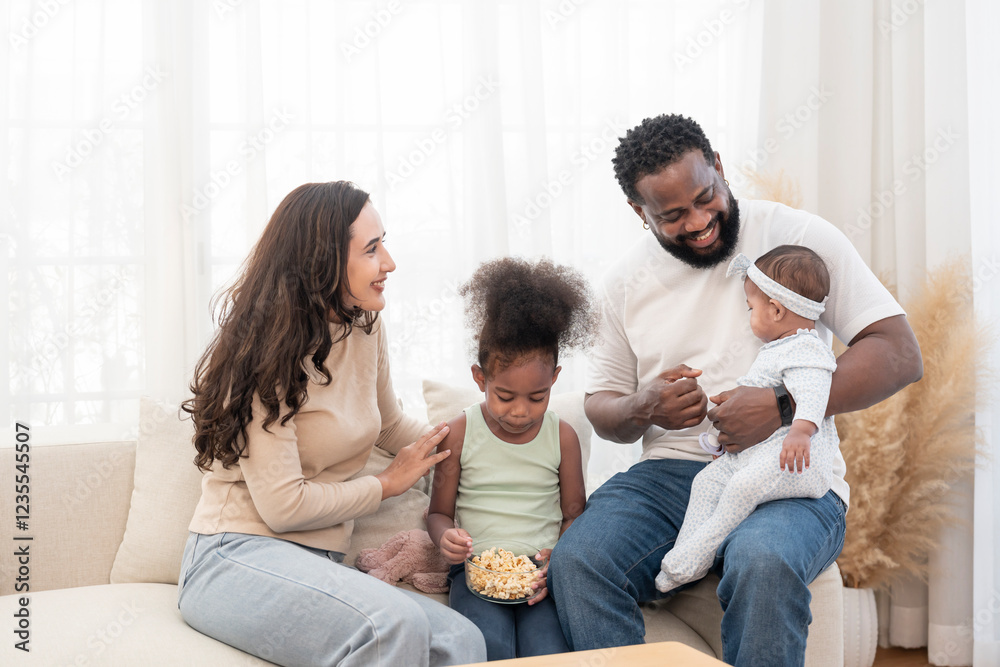 scene of bonding interracial family spend free time together in the living room,cozy home,domestic life scene of bonding interracial family spend free time together in the living room,cozy home,domestic life