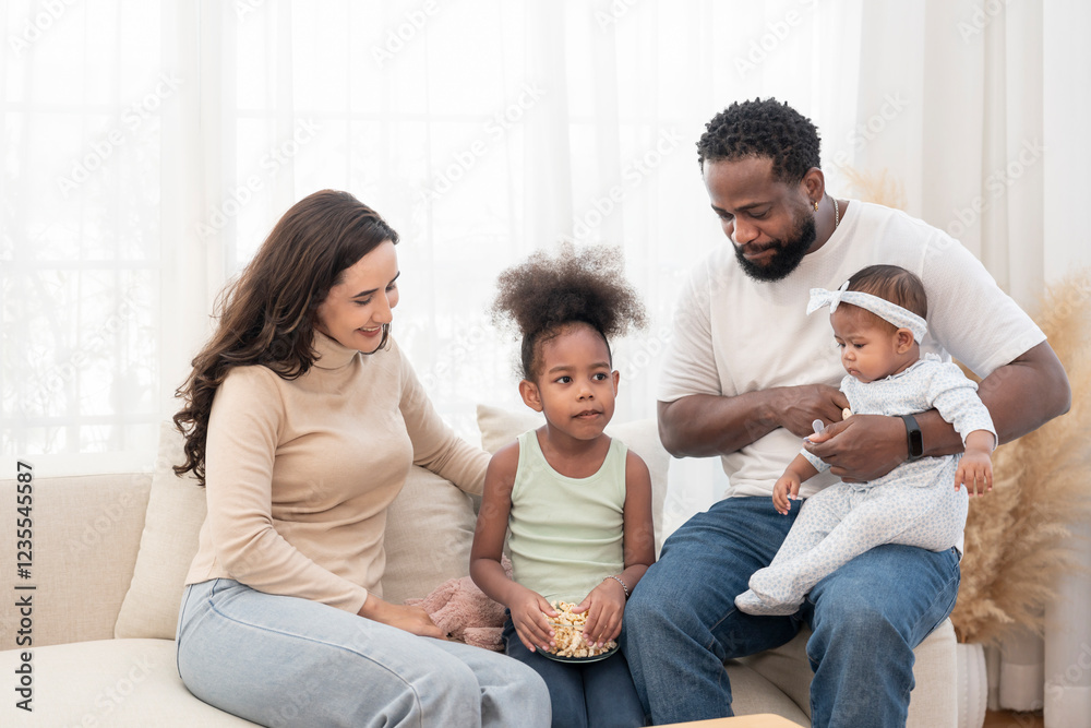 scene of bonding interracial family spend free time together in the living room,cozy home,domestic life scene of bonding interracial family spend free time together in the living room,cozy home,domestic life