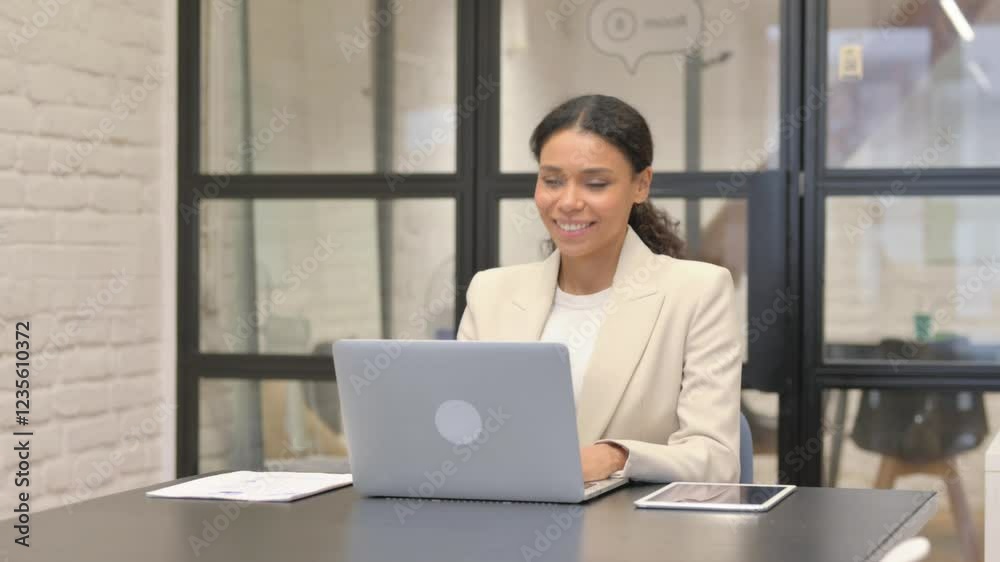 African Business Woman Doing Video Chat via Laptop African Business Woman Doing Video Chat via Laptop