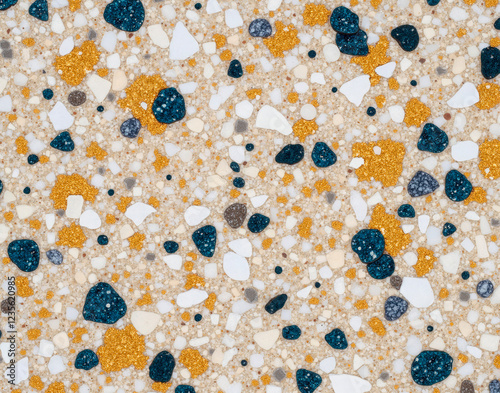 Seamless terrazzo marble composite with gold flecks and crushed sapphire chips, epoxy resin binder texture for industrial floor tiling. photo