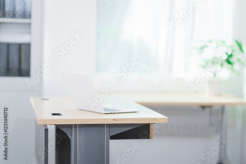 Wallpaper Mural Blank white laptop on blank office desk with blurry white background for display your ads. Torontodigital.ca