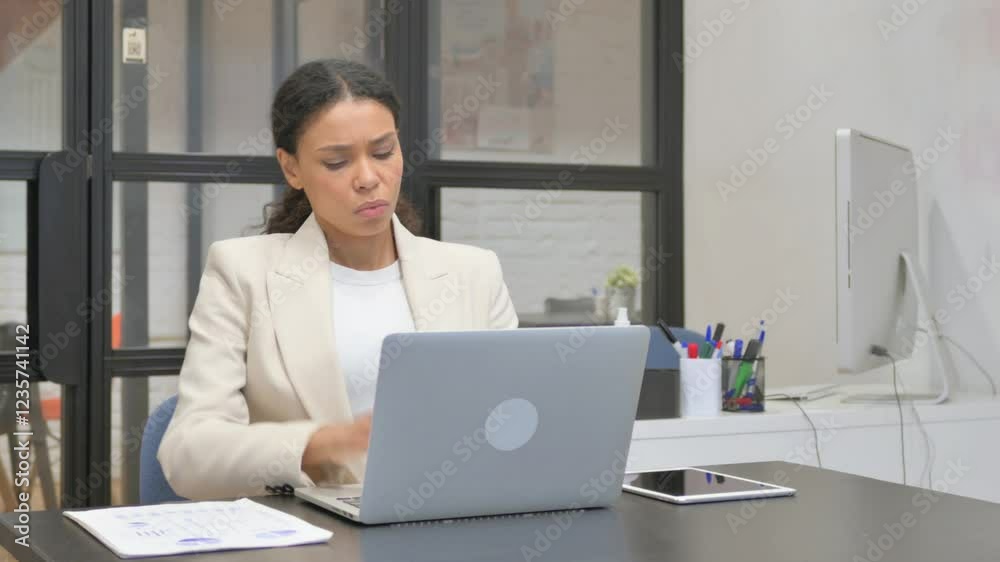 African Business Woman having Back Fatigue and Pain in Office African Business Woman having Back Fatigue and Pain in Office