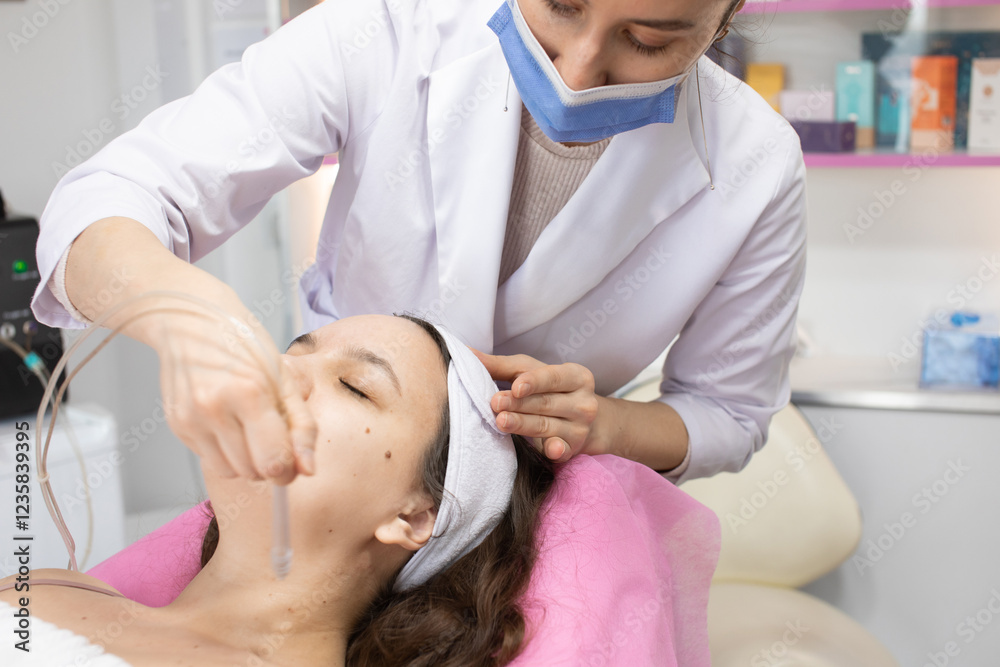 Obraz premium Face Beauty Treatment. Close up of female client getting facial gas-liquid oxygen water epidermal peeling using hardware apparatus