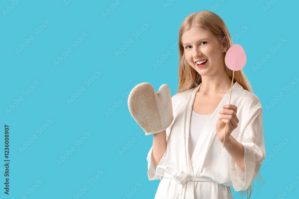 Young woman with massage glove and Easter decor on color background Young woman with massage glove and Easter decor on color background