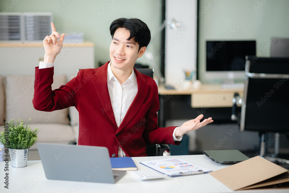 Confident businessman working on finance analysis with a tablet and laptop at office desk. Confident businessman working on finance analysis with a tablet and laptop at office desk.