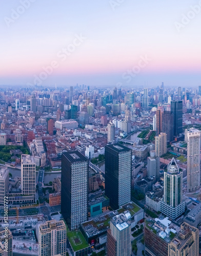 Aerial view of Shanghai skyscraper and residential houses at sunrise