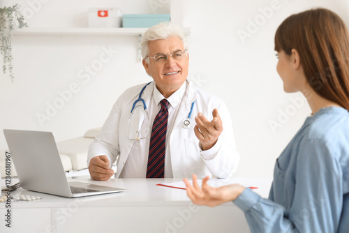 Male doctor working with fe...