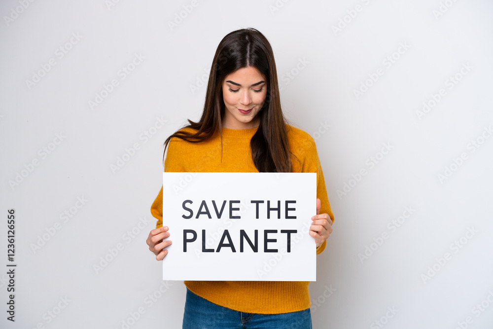 Young Brazilian woman isolated on white background holding a placard with text Save the Planet Young Brazilian woman isolated on white background holding a placard with text Save the Planet