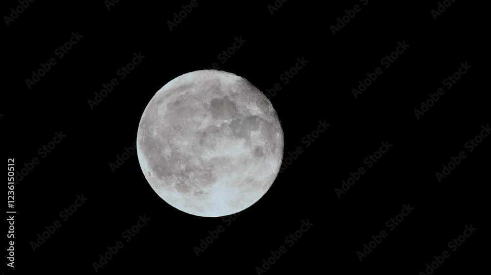 Full moon rises through dark clouds in stunning 4k cinematic time lapse capturing the beauty of the night sky Full moon rises through dark clouds in stunning 4k cinematic time lapse capturing the beauty of the night sky