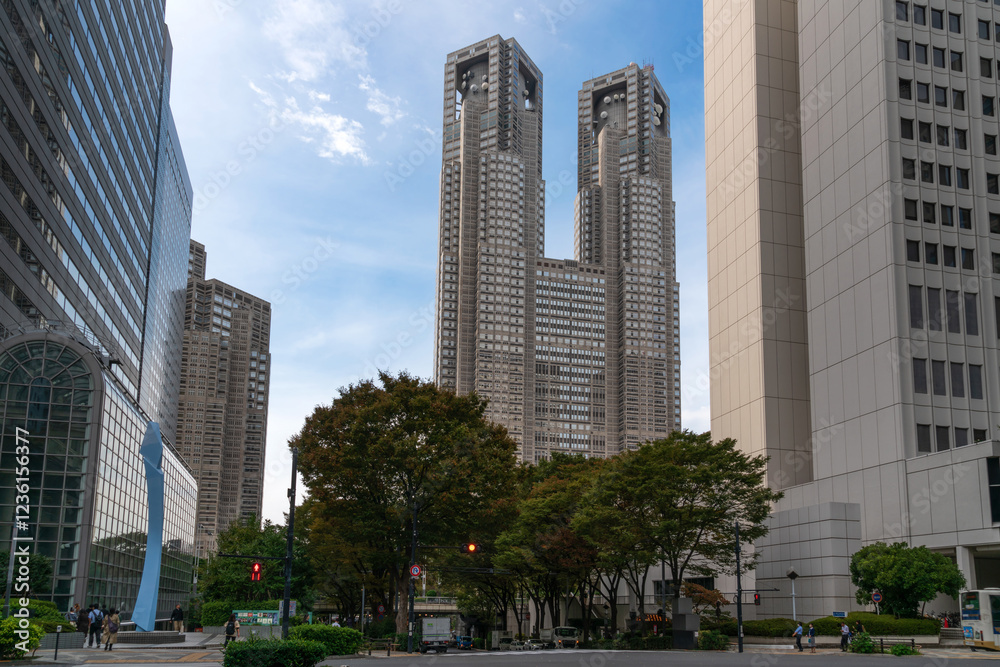 View of the Tokyo Metropolitan Government Building in the Shinjuku area from the street Fureai-dori Ave on a sunny autumn day, Tokyo, Japan View of the Tokyo Metropolitan Government Building in the Shinjuku area from the street Fureai-dori Ave on a sunny autumn day, Tokyo, Japan