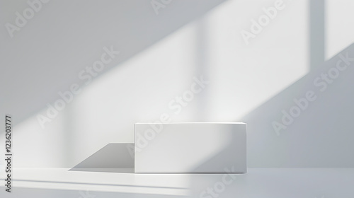 Minimalist white object casting shadows in bright, natural light on a plain surface