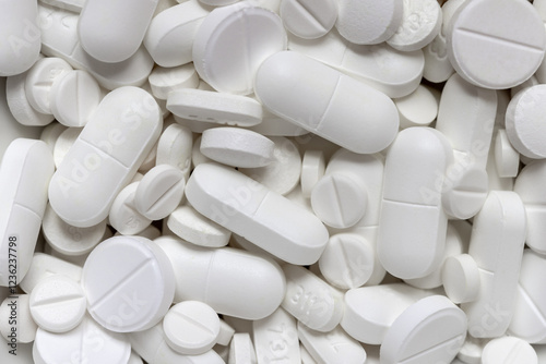 background of various white pills and pills of medicines