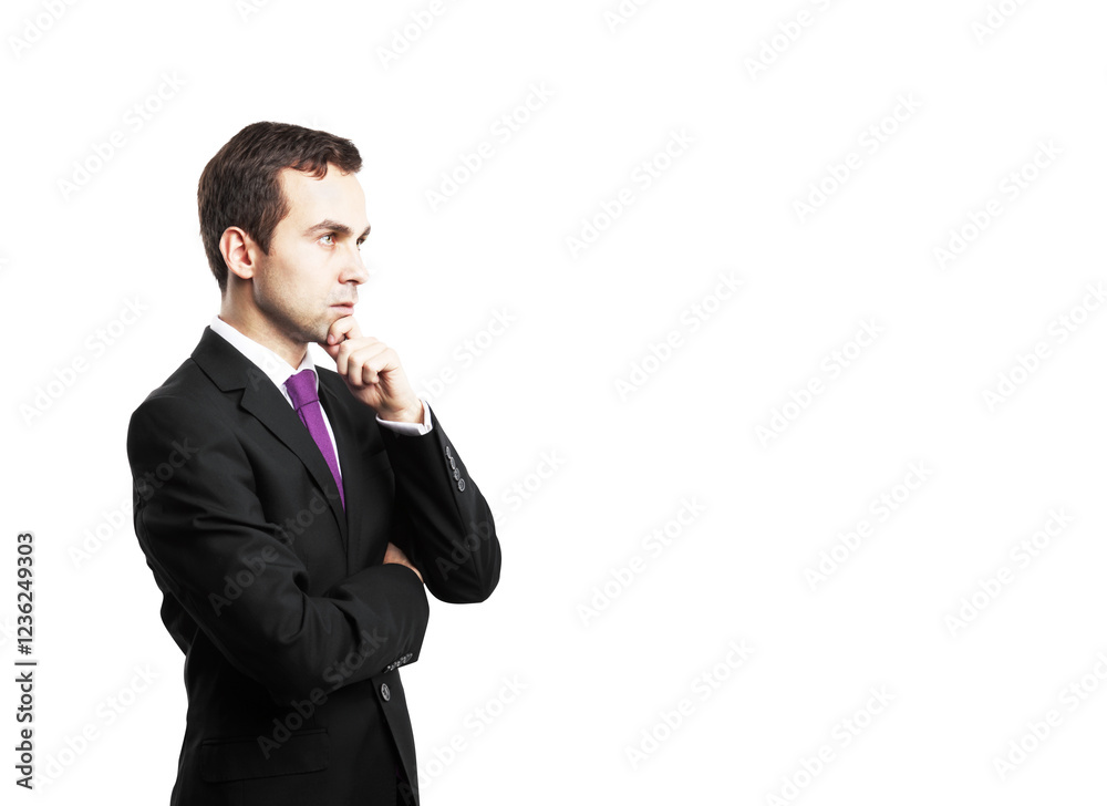 Businessman wearing a suit and purple tie, posing thoughtfully with hand on chin, isolated on a white background. Concept of contemplation Businessman wearing a suit and purple tie, posing thoughtfully with hand on chin, isolated on a white background. Concept of contemplation