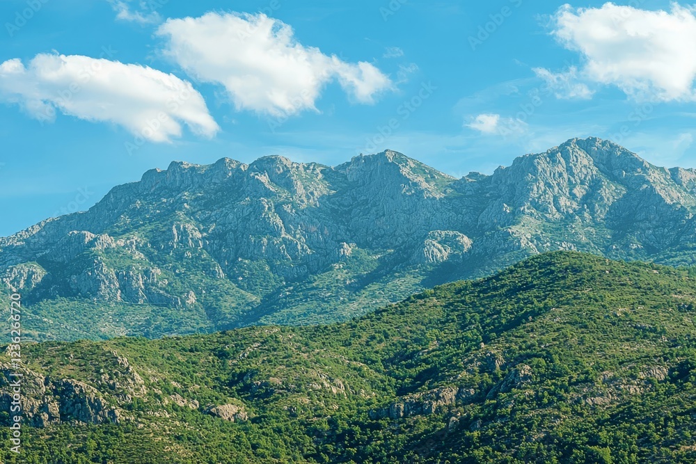 Fototapeta premium Beautiful picturesque green mountains against the blue sky.
