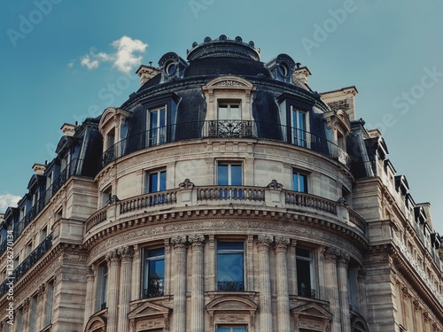 Canvas Print Classic Haussmann-style building in Paris, France, featuring elegant balconies, ornate stonework, and mansard roof