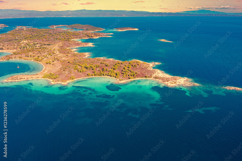 Seascape view with a beautiful bay on a sunny day. View from above on Diaporos island near Vourvourou, Greece, Europe