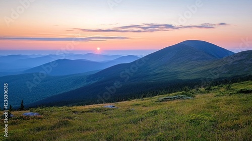 Sunset Over Rolling Hills and Mountains