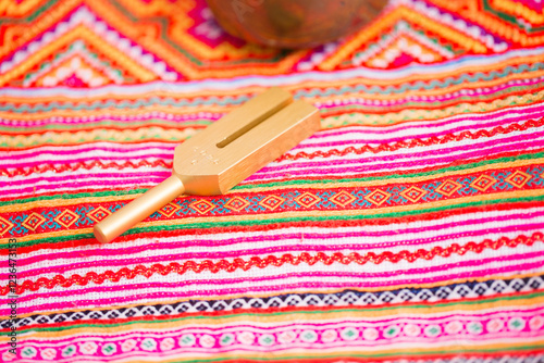 tuning fork on a fabric.