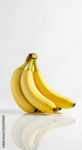 Bunch of fresh yellow bananas against white background