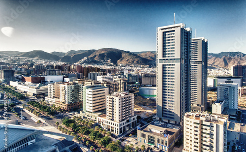 Aerial view of Santa Cruz de Tenerife on a sunny day. Skyscrapers and coastline from drone, Canary Islands photo