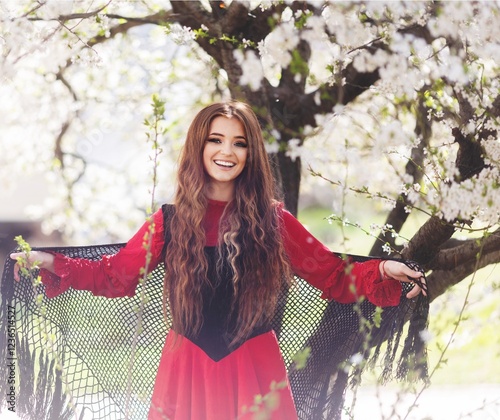 фотографія Girl enjoys the silence and beauty of spring nature