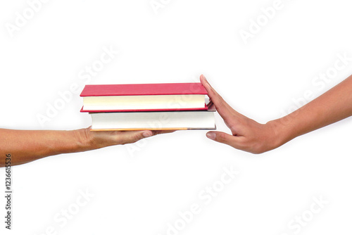 The hand of a person giving a book or sharing books But was denied sharing books on white background. Exchange knowledge and education Concept.