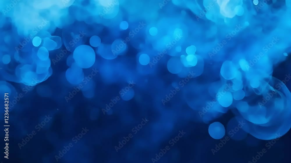 Abstract blue bokeh background with glowing circles for festive designs or presentations