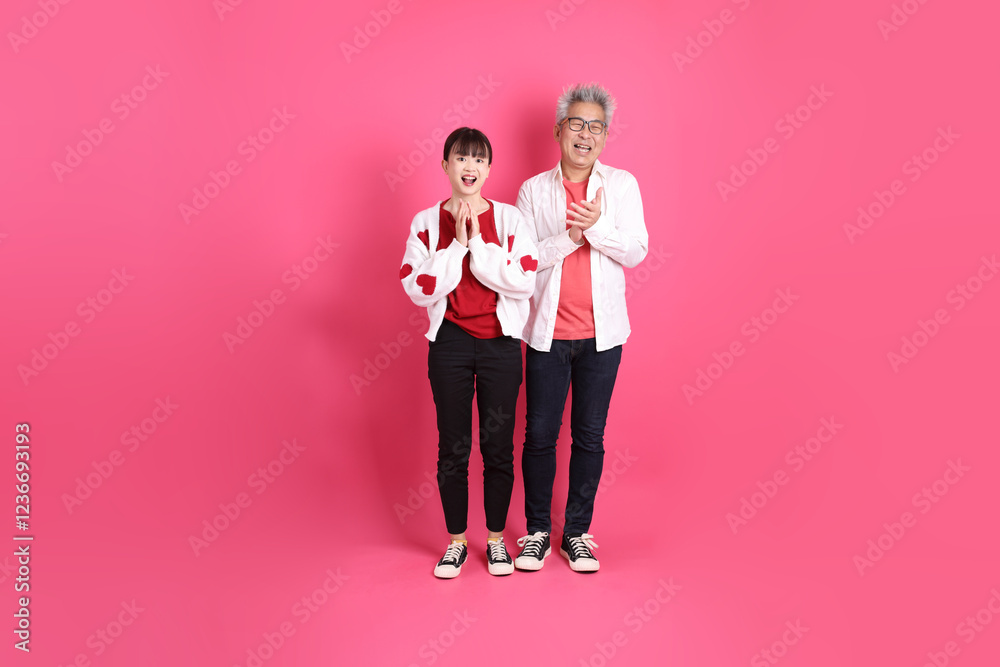 man and woman in red clothes man and woman in red clothes