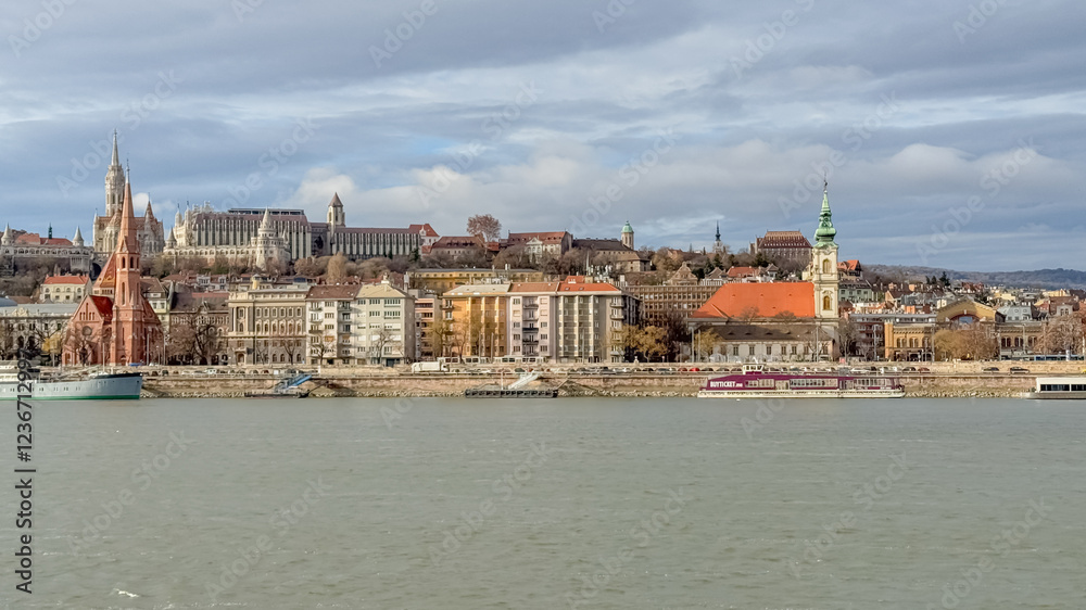 Fototapeta premium Scenic view of Budapest's historic architecture along the Danube River, symbolizing European travel and exploration