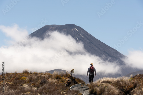 Hiker on the Tongariro Alpine Crossing with Mount Ngauruhoe, New Zealand