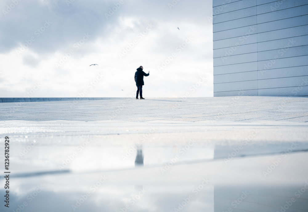  silhouette of a person moving towards a high wall