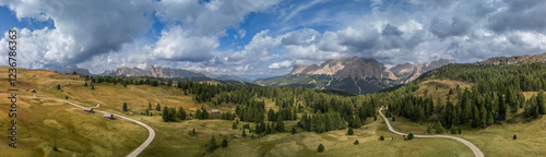 Wallpaper Mural Expansive aerial view of the Pralongia Plateau in the Dolomites, Italy. Captures vibrant pastures, forested slopes, and the rugged Sella massif Torontodigital.ca