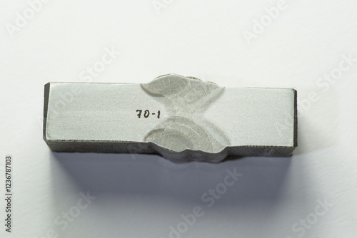 Macro etched cross-section of a butt weld Joint prepared for metallurgical examination –  analysis of welded metal structure. shows the heat-affected zone (HAZ), weld penetration, fusion boundaries.