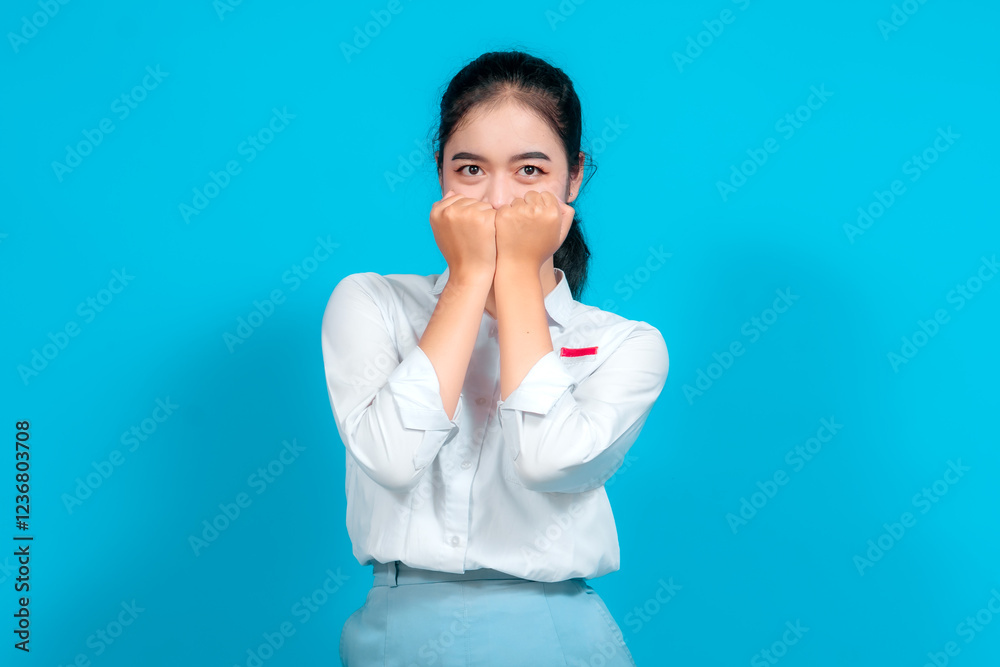 Portrait female student poses joyfully against a vibrant blue background Portrait female student poses joyfully against a vibrant blue background
