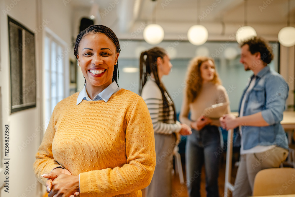 Obraz premium portrait of happy african american woman stand arm crossed at office