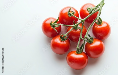 Wallpaper Mural Close up view of a cluster of eight red cherry tomatoes on the vine, arranged on a bright white background. The tomatoes are vibrant in color and Torontodigital.ca