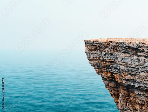 Serene cliff by the tranquil ocean waters.