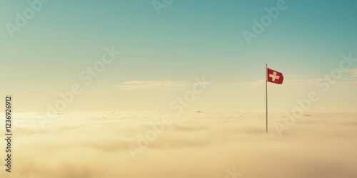 a swiss flag flying above the clouds