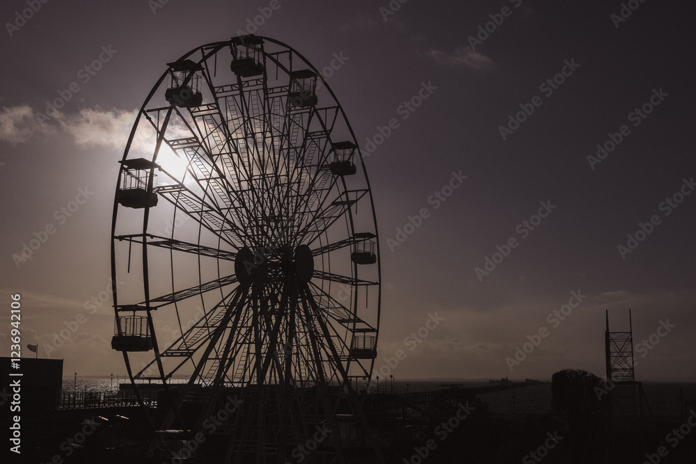 Ferris Wheel Silhouette Against the Setting Sun in Southend on Sea Ferris Wheel Silhouette Against the Setting Sun in Southend on Sea
